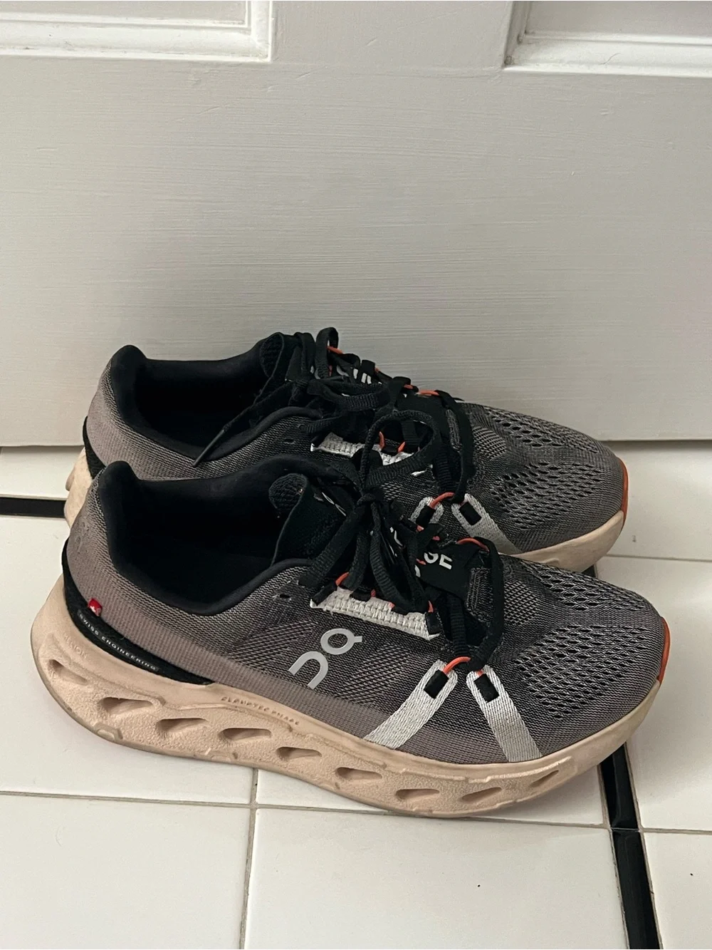 On Women’s Cloudsurfer Next running shoes in Gray and Black